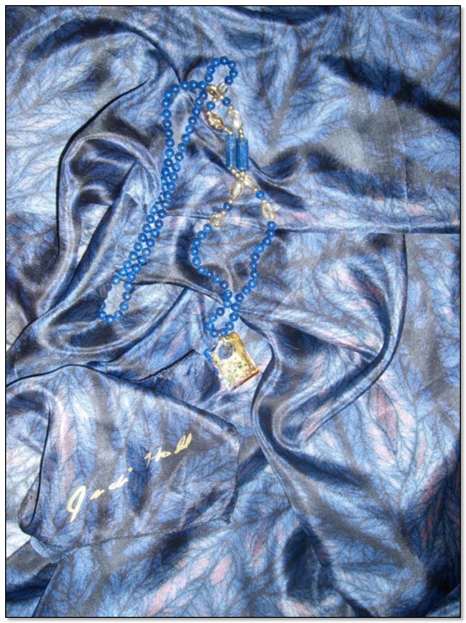 A beautiful blue silk shawl by Gingezel used for a celebrity charity auction.